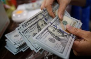 Dollar retreats ahead of key payrolls data