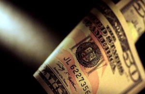 Dollar rises close to three-month highs after weak Chinese data