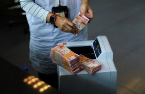 Indonesia central bank intervenes to defend rupiah, open to buying bonds