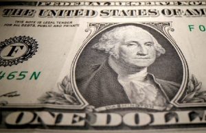 Dollar retreats in thin volumes; Fed monetary policy in focus