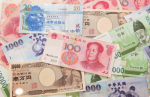 Asian Currencies Slip as Dollar Gains Ground Amid Israel-Iran Tensions; BOJ Decision Looms