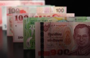 Asian currencies hold steady after Powell comments; Aussie rises on CPI surprise