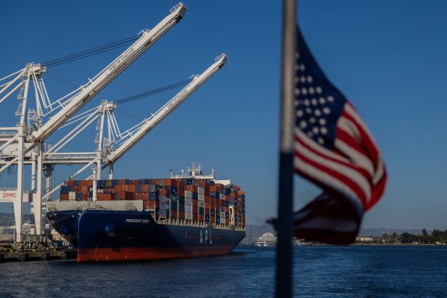 A cargo ship full of shipping containers is seen at the port of Oakland, California