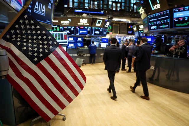 Traders work on the floor of the NYSE in New York