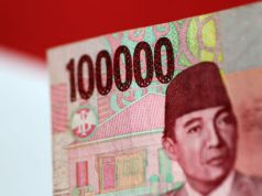 Asian FX flat as dollar strengthens for the week, yen wobbles before vote