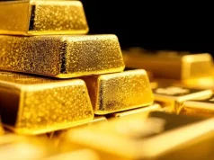 Gold Trims Losses While Dollar Surges on Iran War Escalation