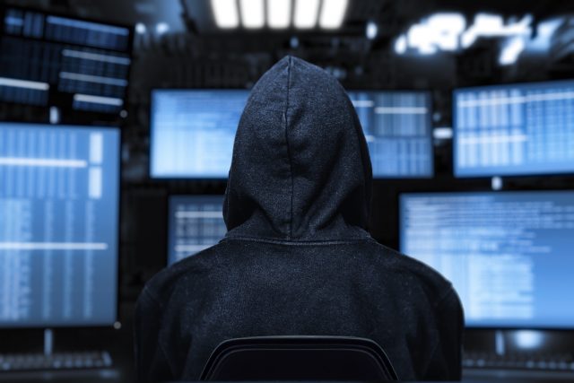 computer hacker with device screen
