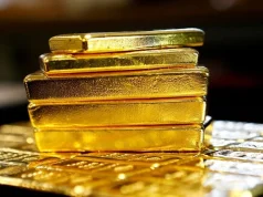 Gold Holds Near $4,400 as Strong Payrolls and Iran Tensions Lift Fed Hike Bets